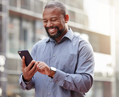 A man looking at stats on his phone