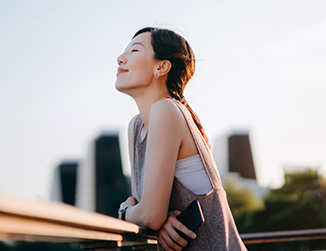 Woman thoughtfully looking skyward